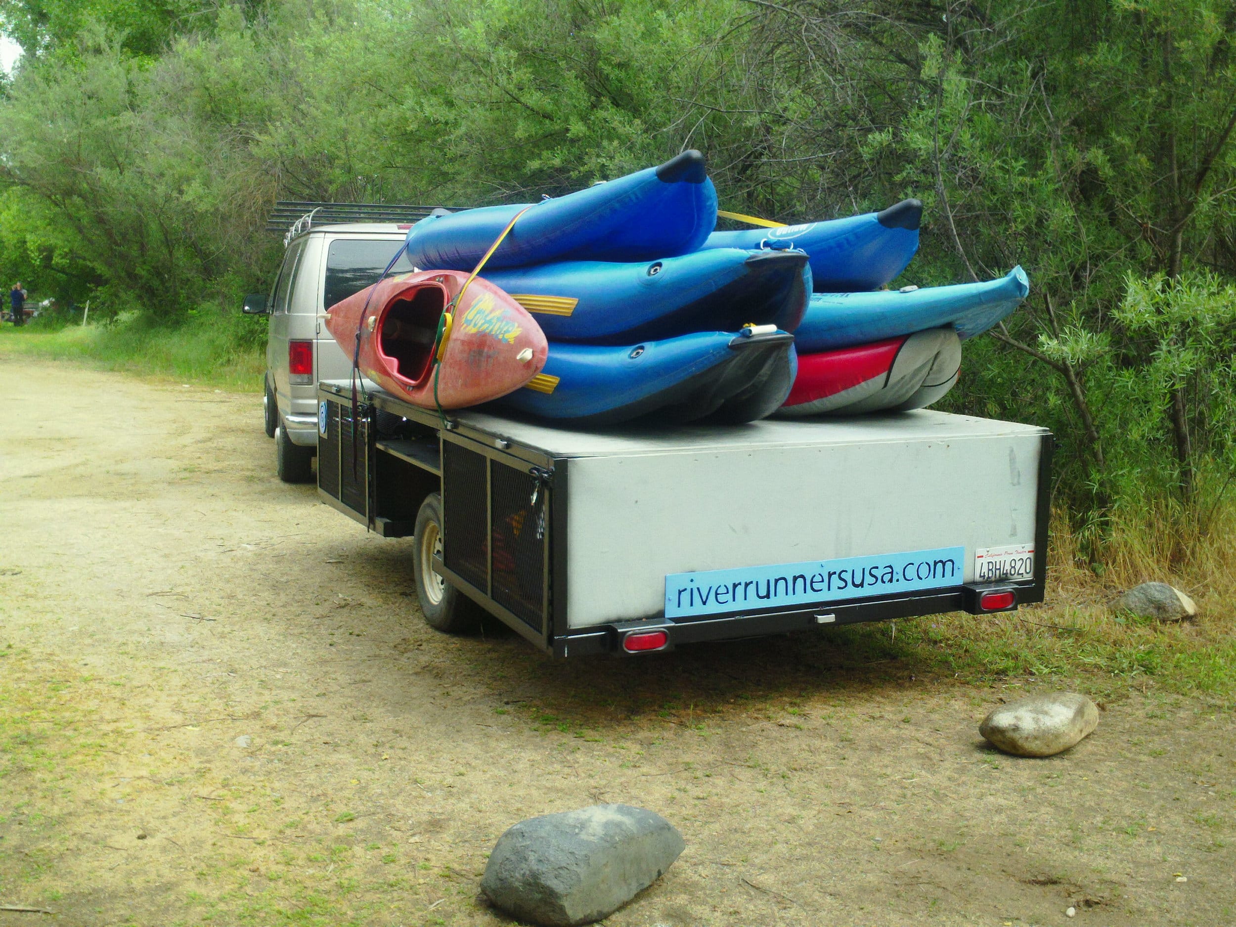 River Runners van and trailer with kayaks ready to go