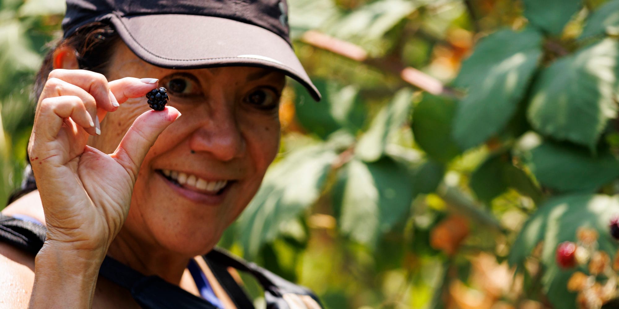 River Runners-Hero-Art2x1036 Picking wild blackberries while whitewater Rafting