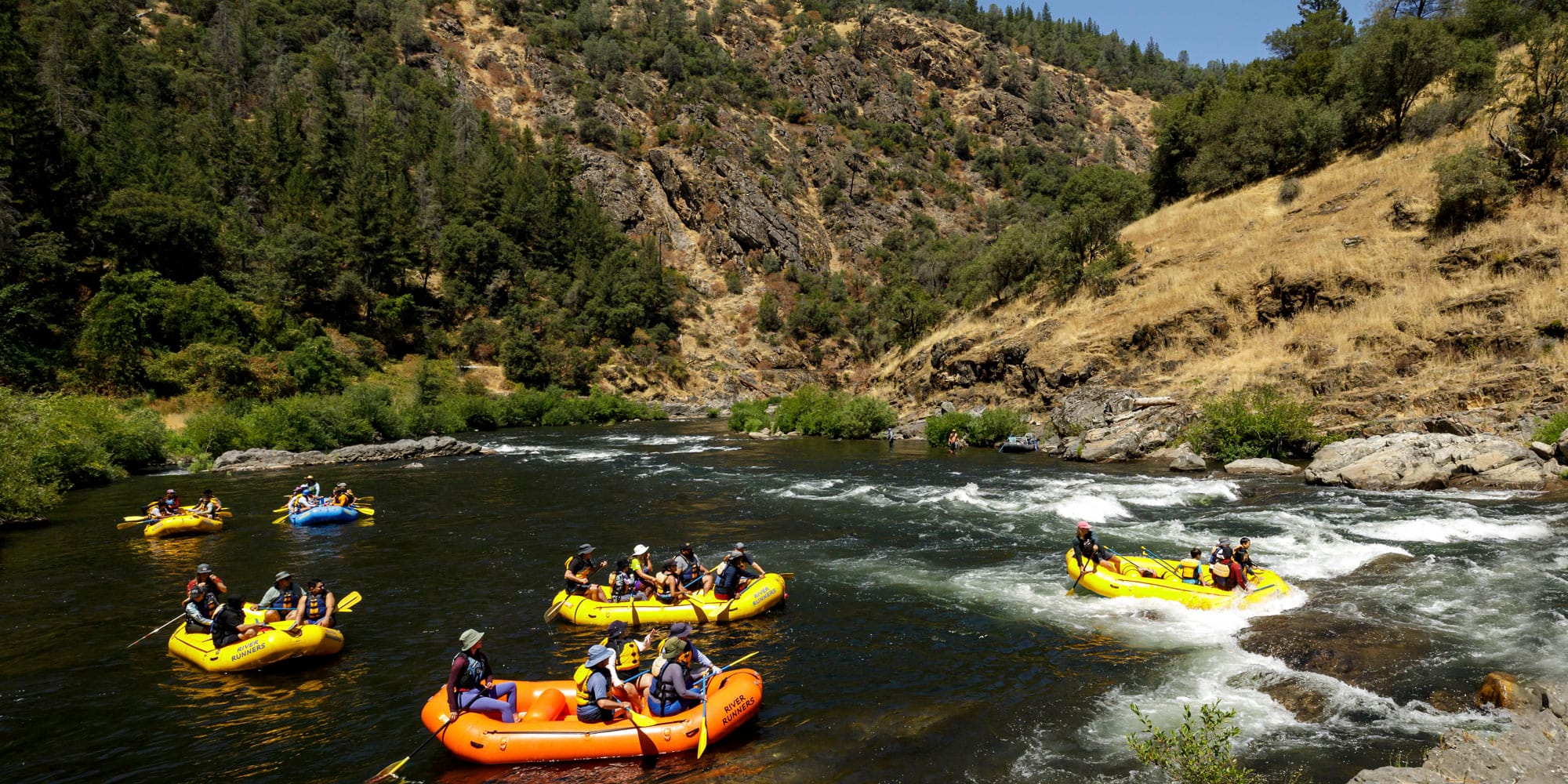 River Runners Rafts stopping to surf at Maya Rapid