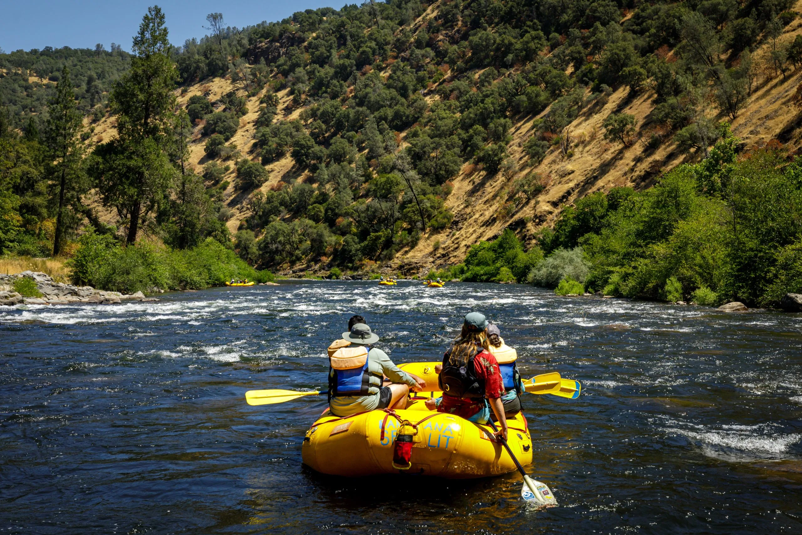 Looking over the shoulder of a River Runners Raft in Rock Garden Rapid
