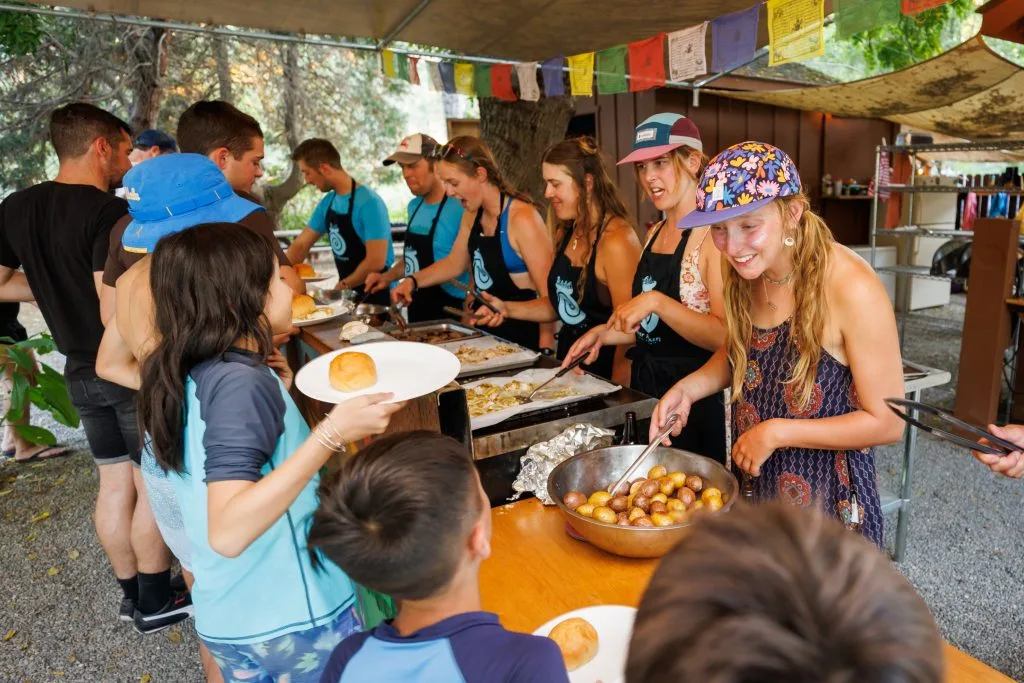 rr-south-fork-gorge-rafting-sb-147 River Runners Guides serving dinner at Camp Lotus